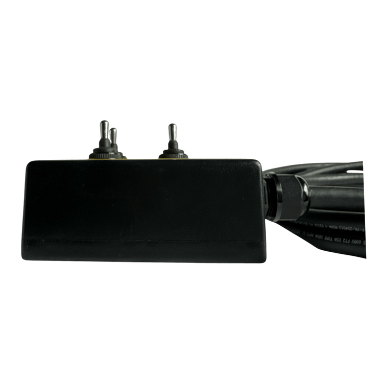 The PIERCE 6 Function Wrecker Remote, a black rectangular device featuring dual toggle switches and attached cables, is showcased against a black background.