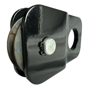 Close-up of a PIERCE Snatch Block WLL 6,000 lbs. featuring a circular metal wheel on a black background.