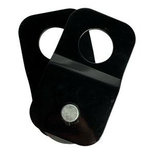 A PIERCE Snatch Block WLL 6,000 lbs., a black metal item featuring circular cutouts and a small round magnet on its surface, is set against a black background.