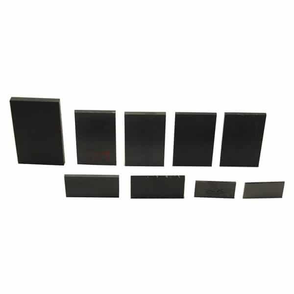 Seven sleek black rectangular magnets of varying sizes, echoing the precision of a PIERCE 601 Wear Pad Kit, are lined up in a row.