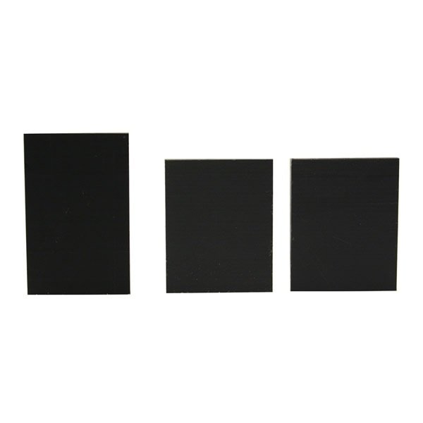 Against a white backdrop, three black rectangular panels stand upright, evoking elements from the PIERCE 701 Wear Pad Kit.